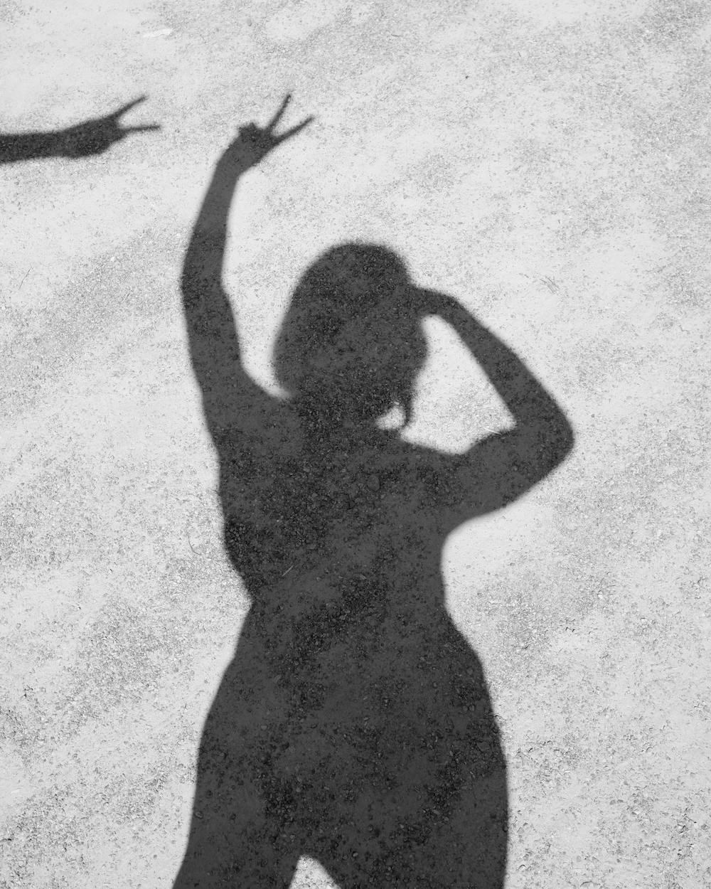 woman-shadow-peace-sign